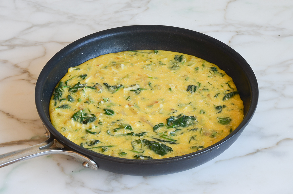 spinach frittata mixture in skillet