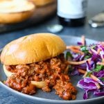 Sloppy joe on a plate with salad.