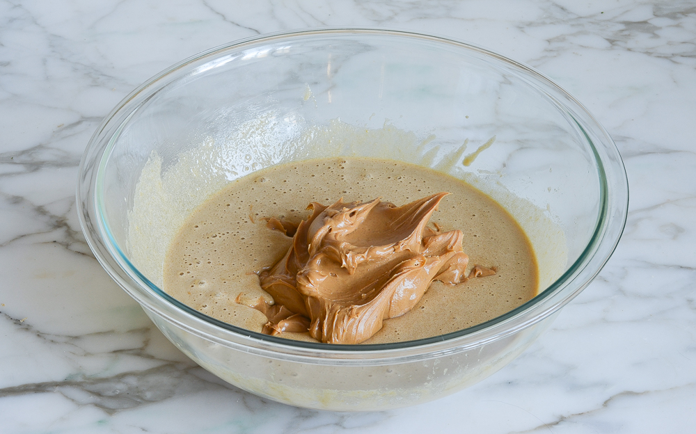 Peanut butter in a bowl with brown sugar mixture.