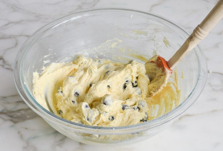 folding the blueberries into the batter