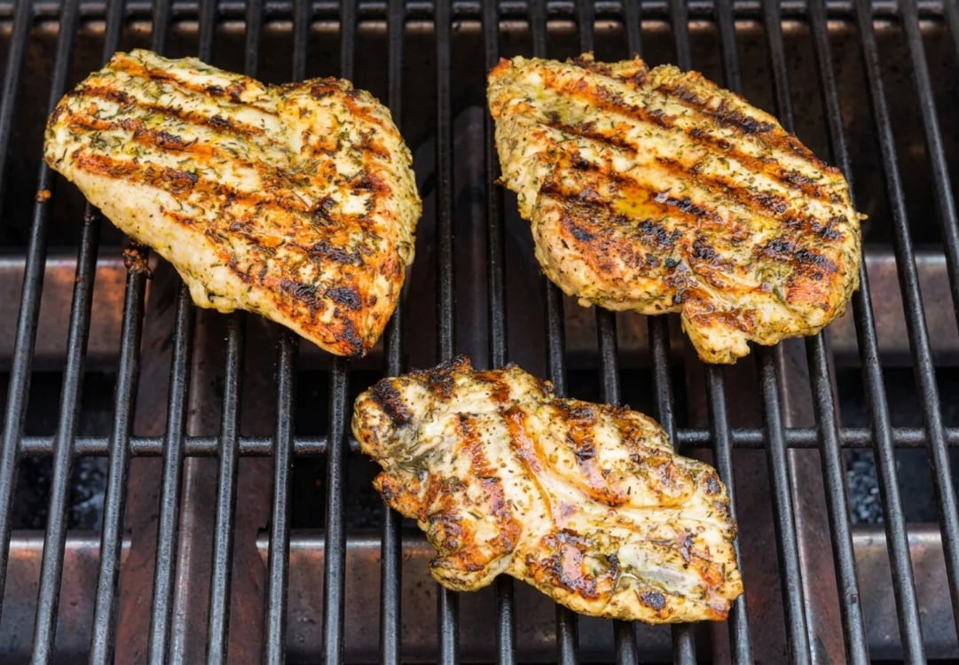 chicken cooking on grill