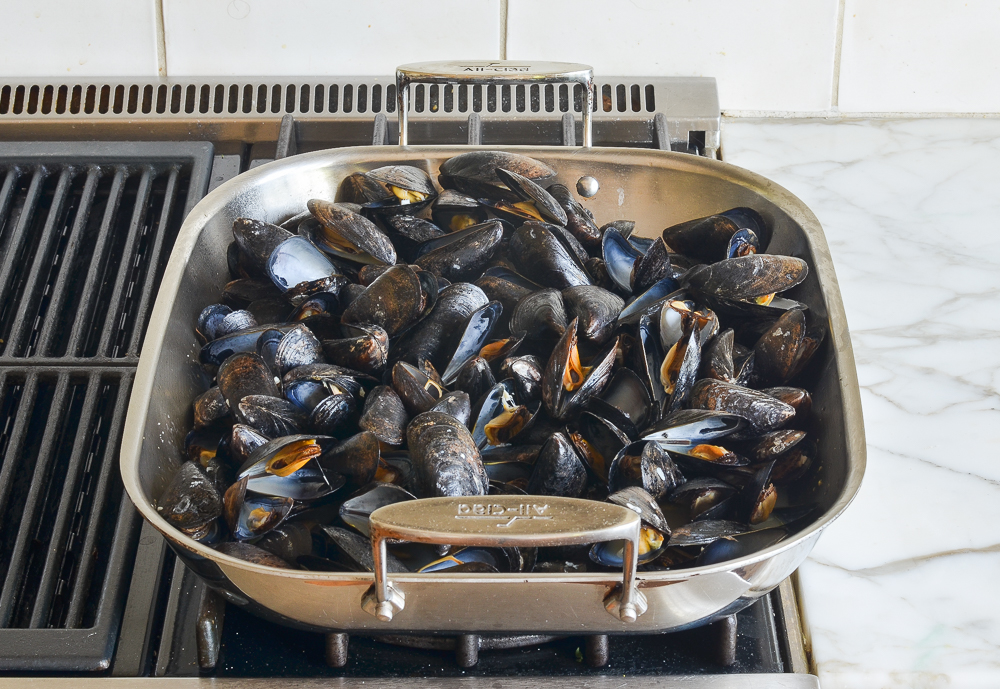 Large pan of steamed mussels.