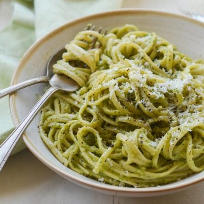 linguine with arugula walnut pesto in bowl