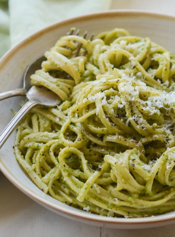 linguine with arugula walnut pesto in bowl