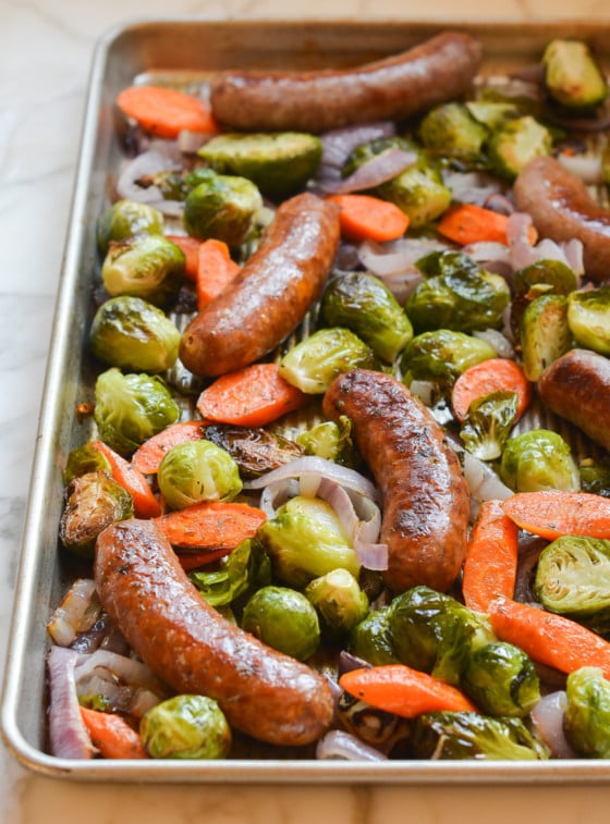 Sheet pan sausage and veggies still on the pan after roasting.
