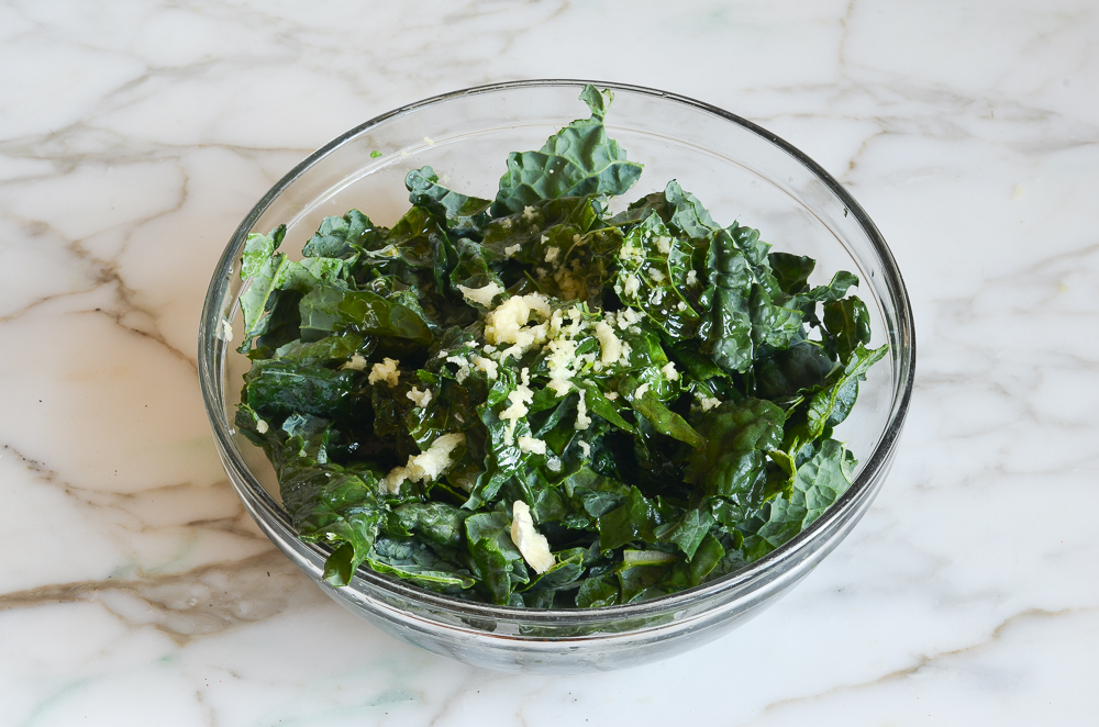 kale, olive oil, and garlic in bowl