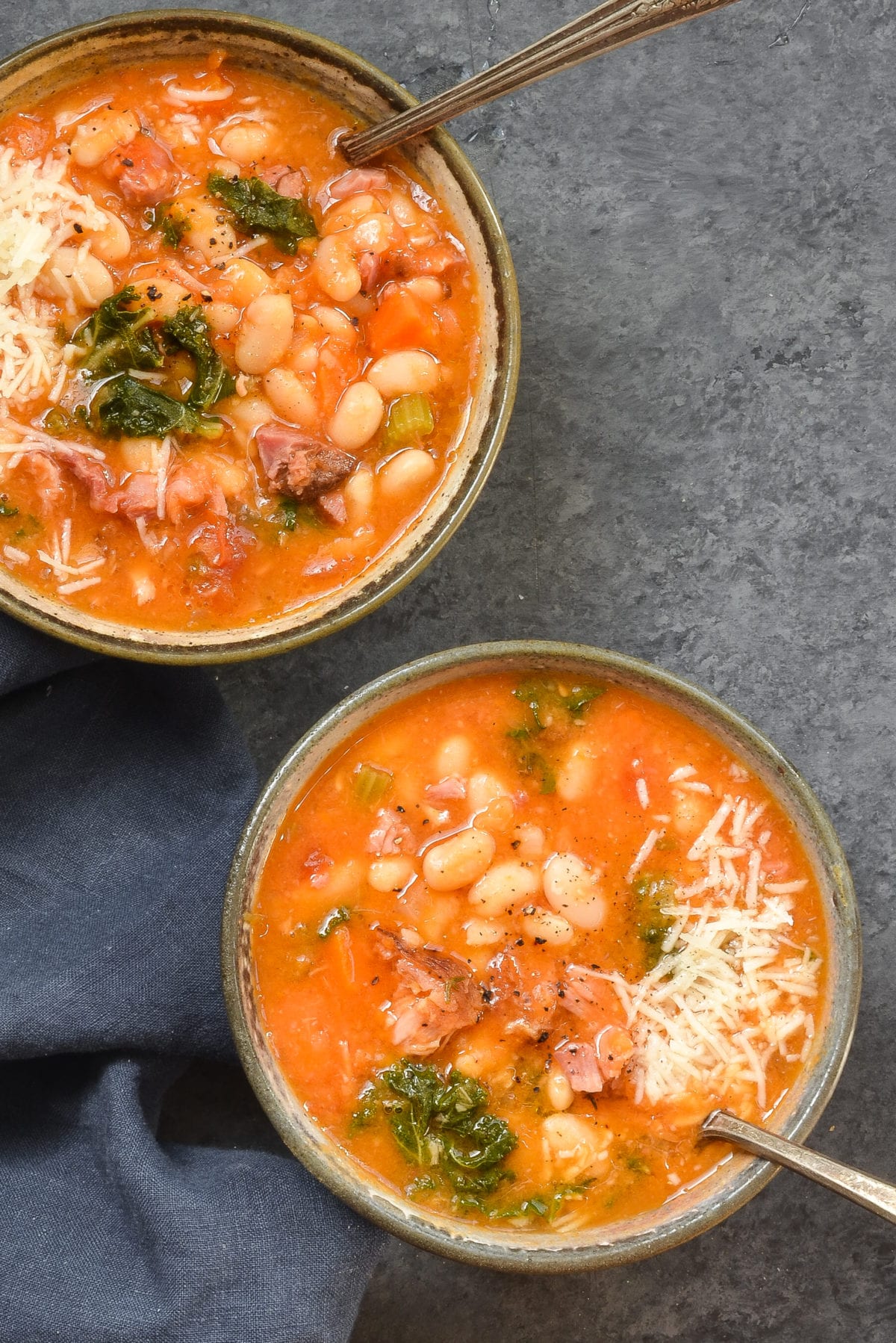 Two bowls of smoky white bean and ham soup.