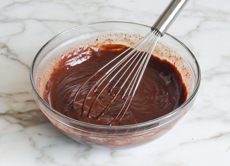 Whisk in a bowl of chocolate ganache.