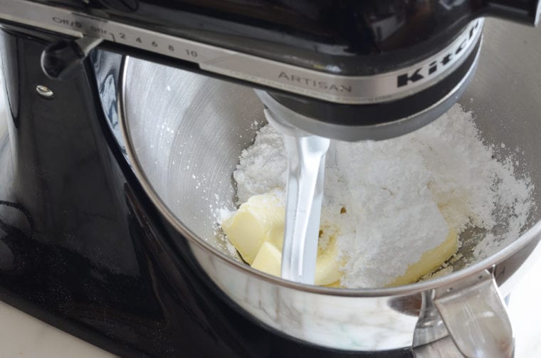 butter and confectioners sugar in mixer