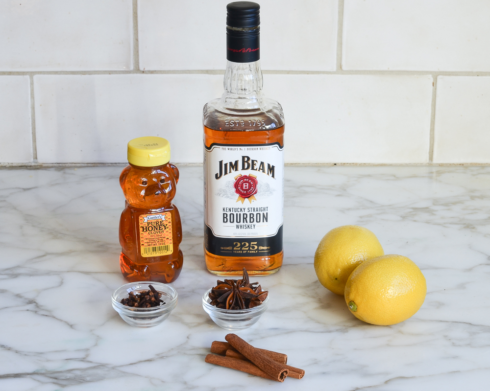 Hot Toddy ingredients, including honey, bourbon, and lemon.