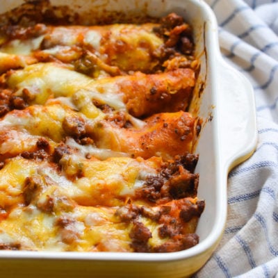 Baking dish of beef enchiladas.