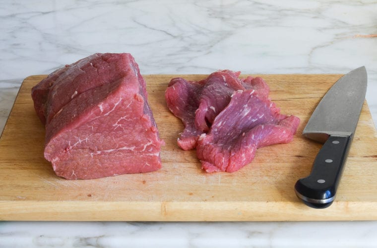 slicing the meat for beef jerky