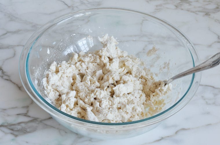 mixing bagel dough with fork