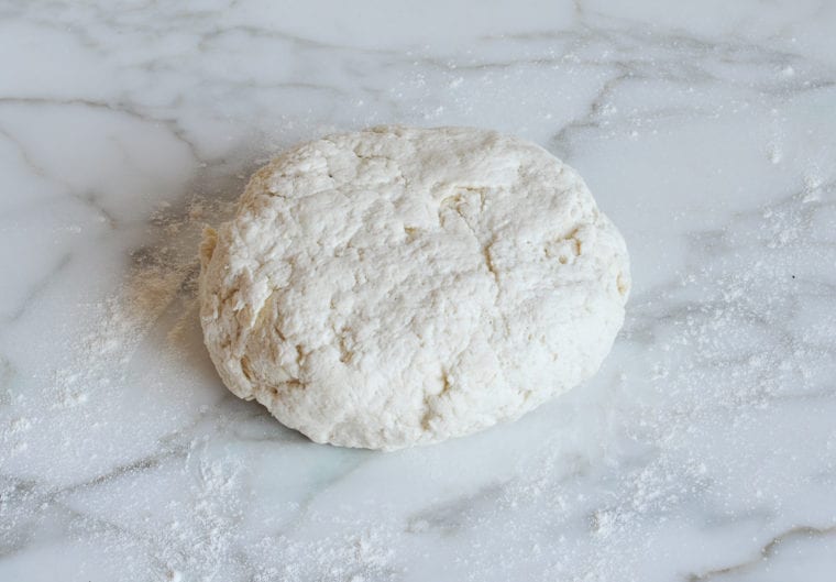 bagel dough on floured work surface