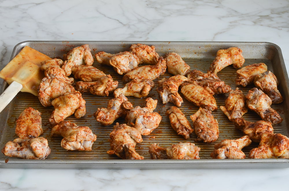 tossed chicken wings ready to bake