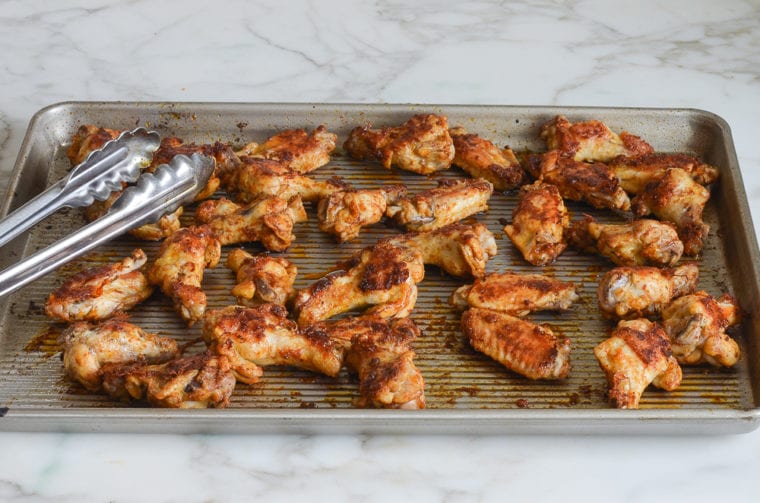flipping chicken wings halfway through baking.