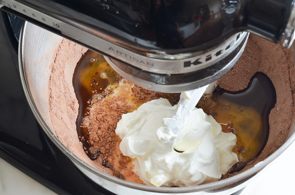 adding eggs, oil, and sour cream