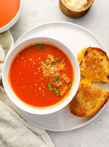 bowl of tomato soup with grilled cheese