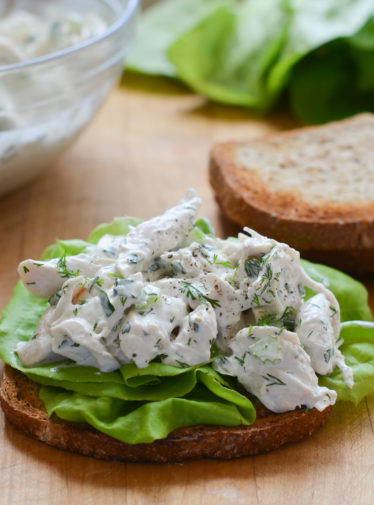 Classic chicken salad on bread with lettuce.
