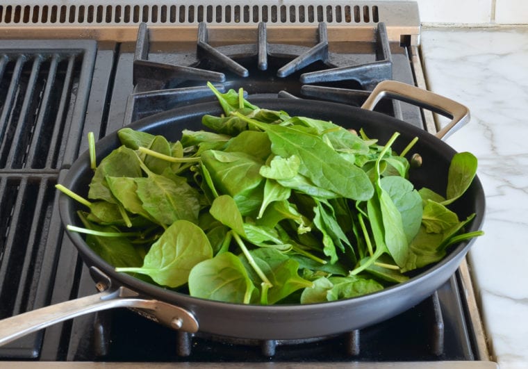 wilting spinach in pan