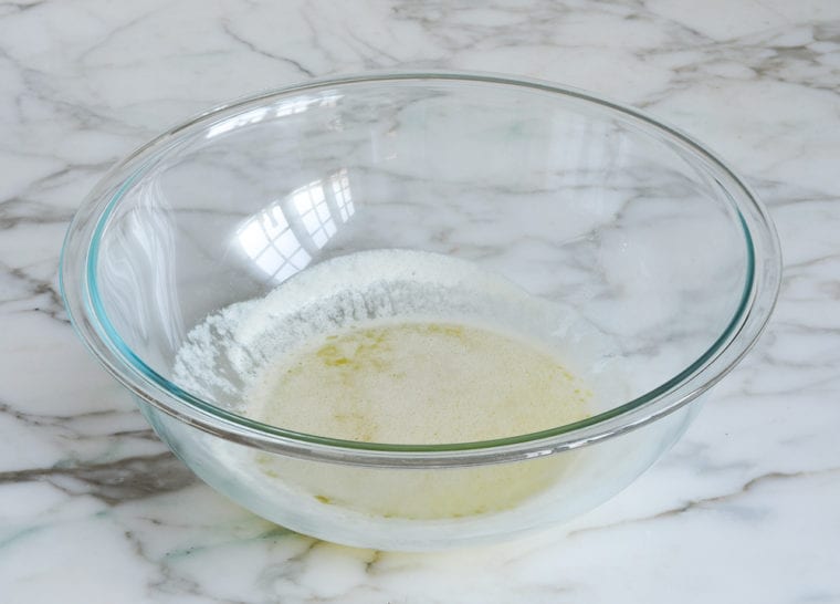 Glass bowl of melted butter.