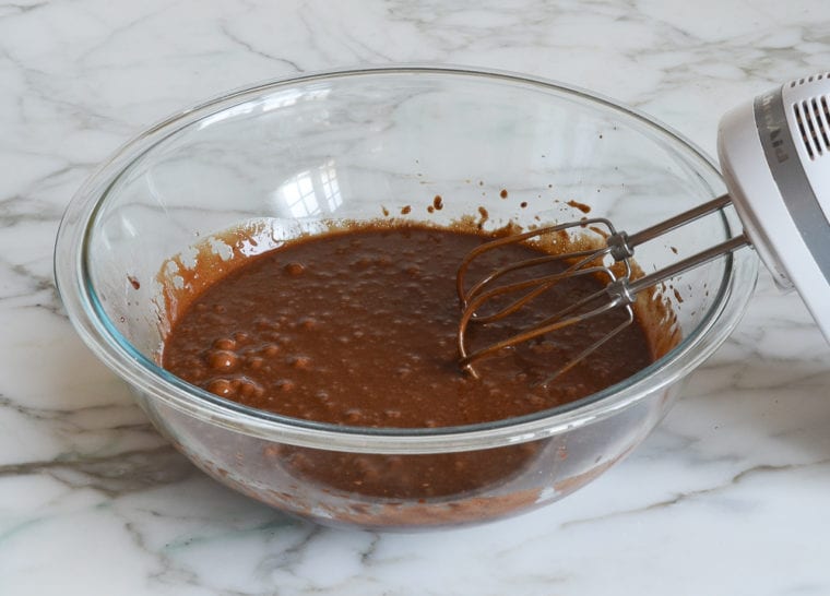 flourless chocolate cake batter after all of the eggs and vanilla are incorporated