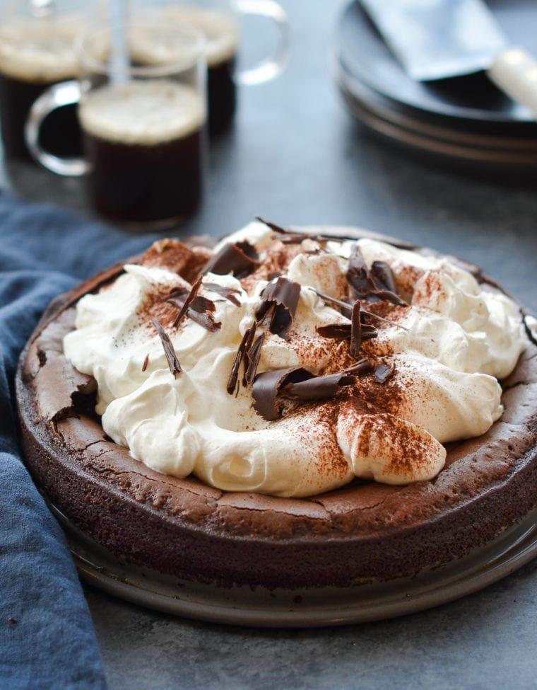 Flourless chocolate cake on a countertop.