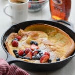 Dutch baby with fruit in a skillet.