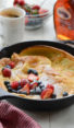Dutch baby with fruit in a skillet.