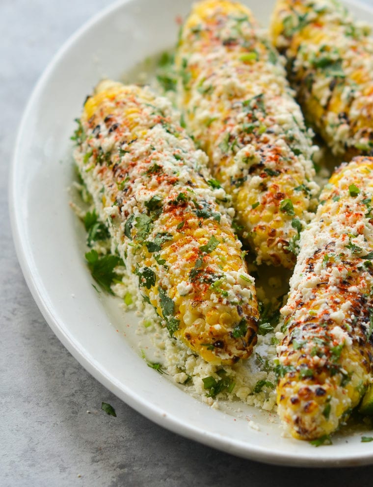 Plate of grilled Mexican street corn (elote.)