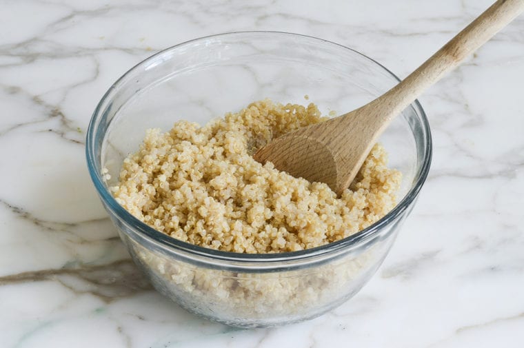 tossing quinoa with oil