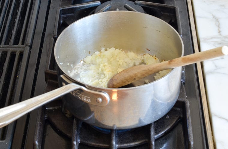 adding garlic to onions