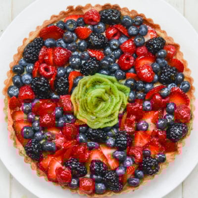 Colorful French fruit tart on a plate.