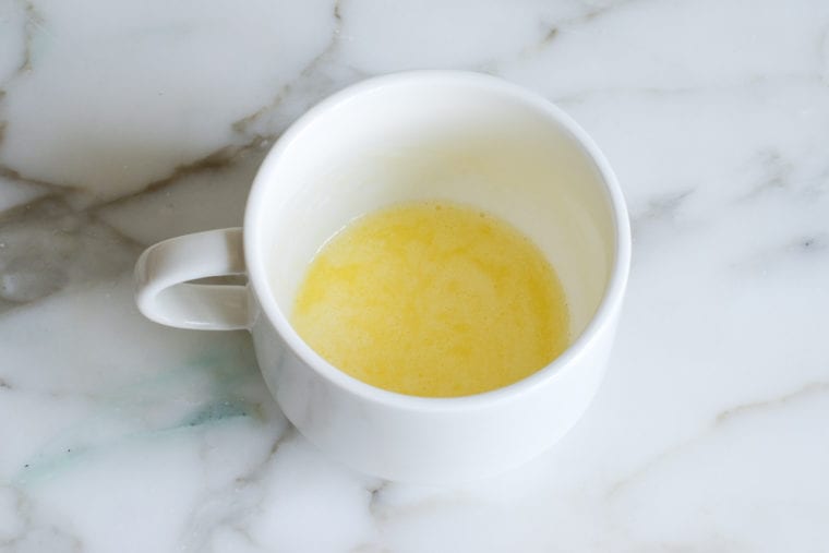 melted butter in a mug