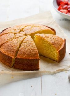 Sliced olive oil cake missing a piece.