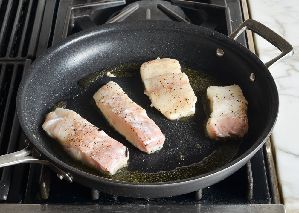 pan-searing halibut on first side