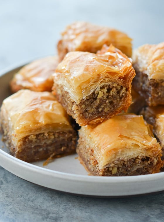 Baklava piled on a plate.