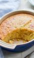 Partially-served dish of spoon bread.