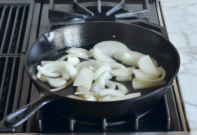 adding onions to skillet