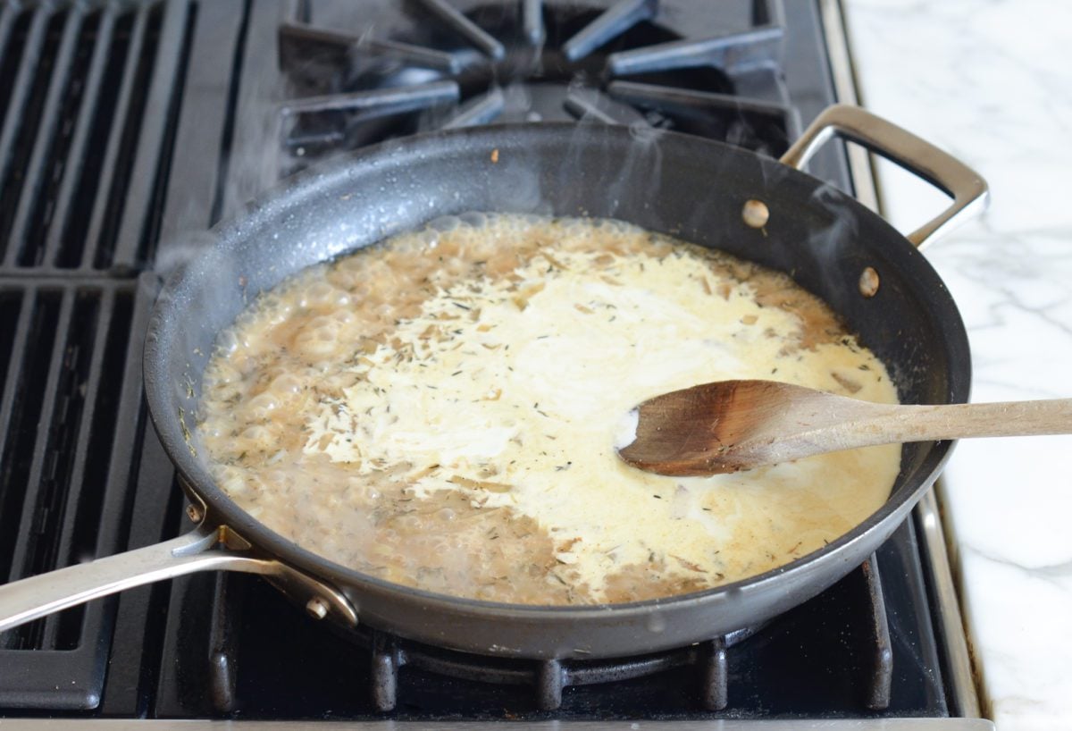 adding cream to reduced liquid in skillet