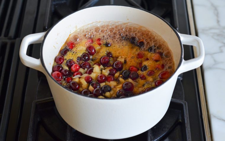 bringing the cranberry chutney to a rapid boil