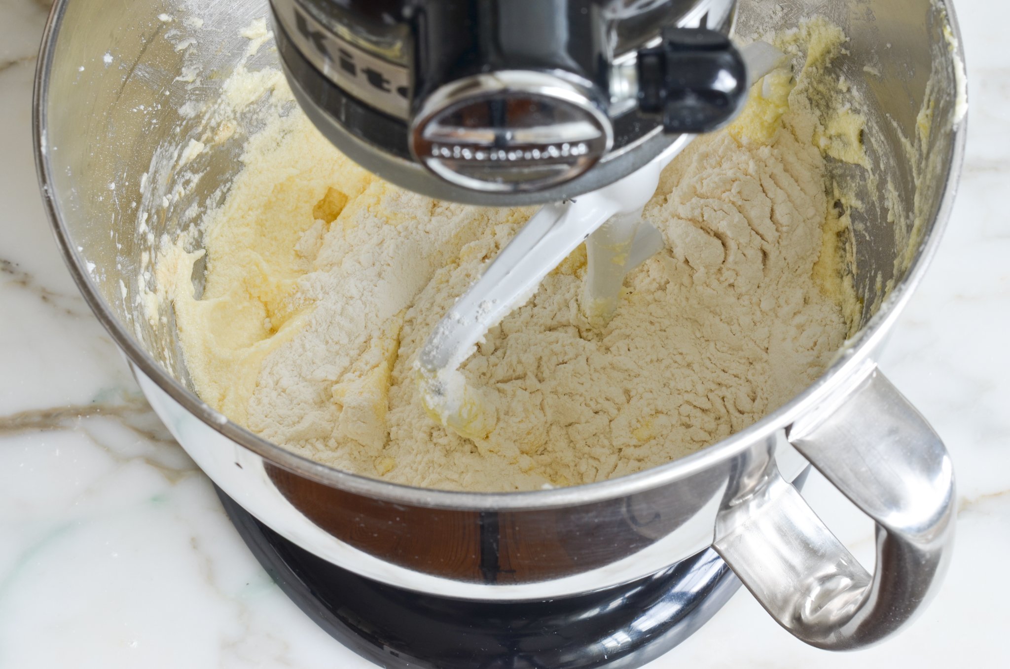 Adding the flour to the batter
