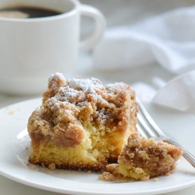 Piece of crumb cake on a plate.