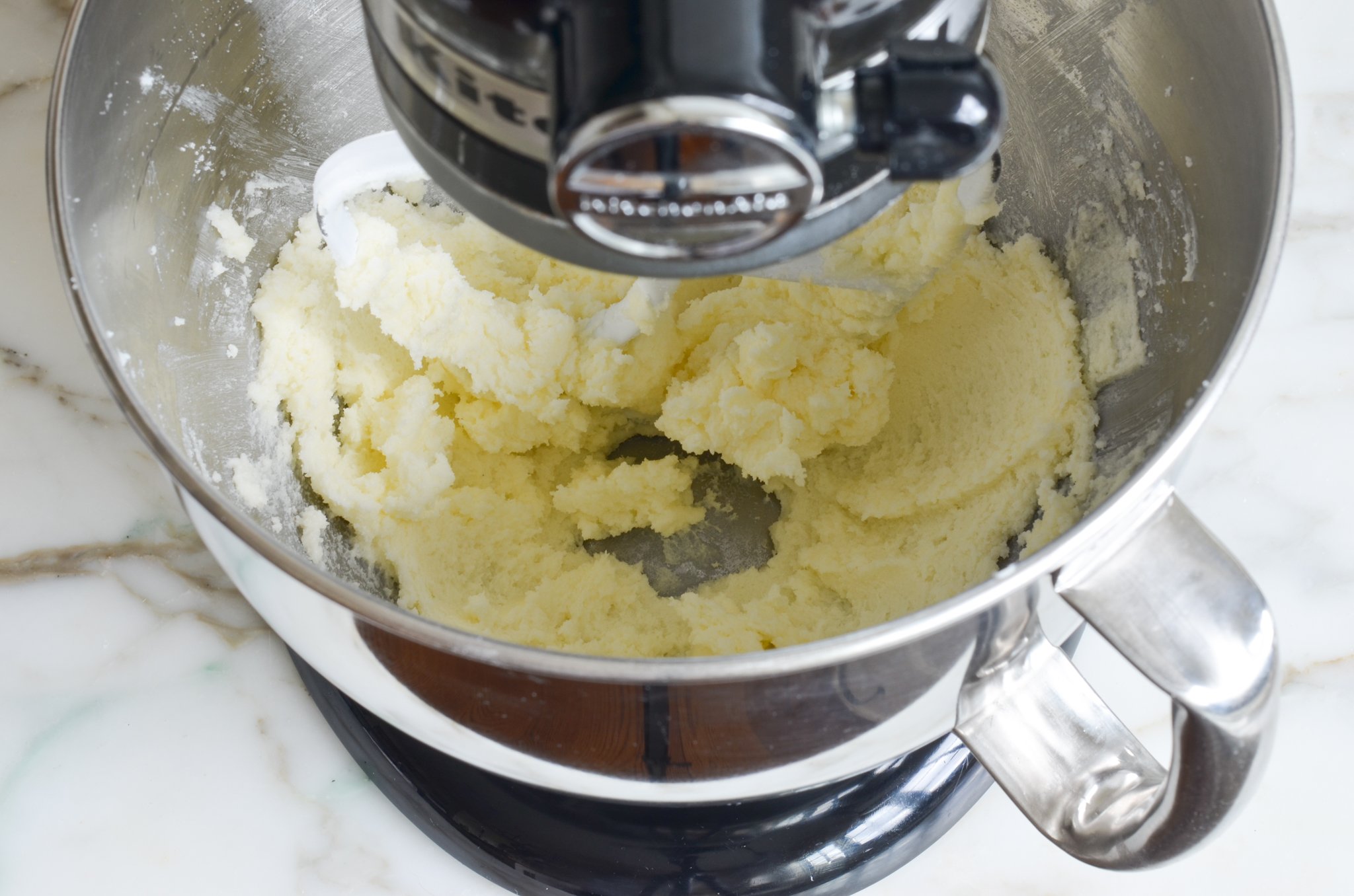 Butter and sugar after beating in a mixing bowl.