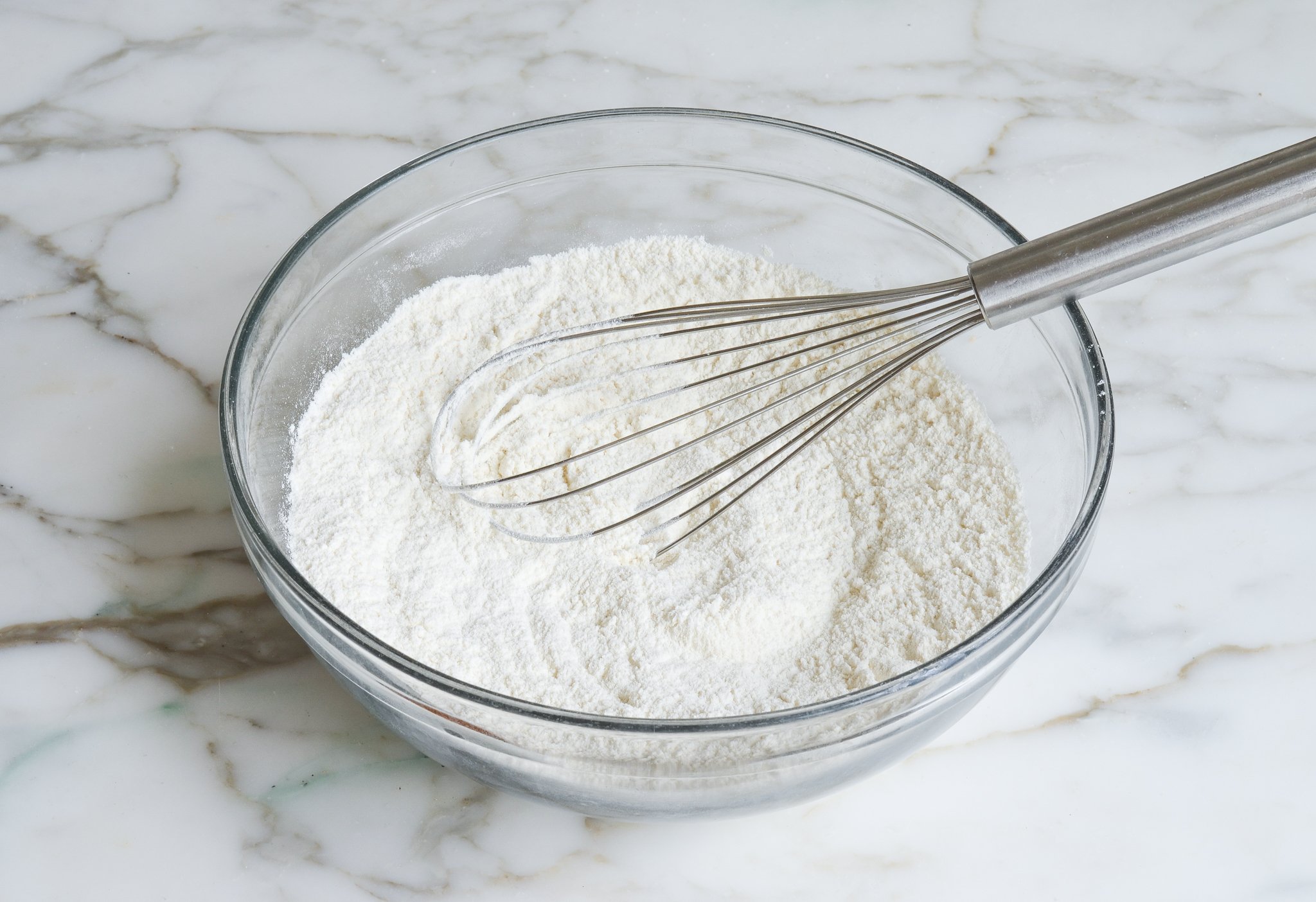 Whisked dry ingredients in a mixing bowl.