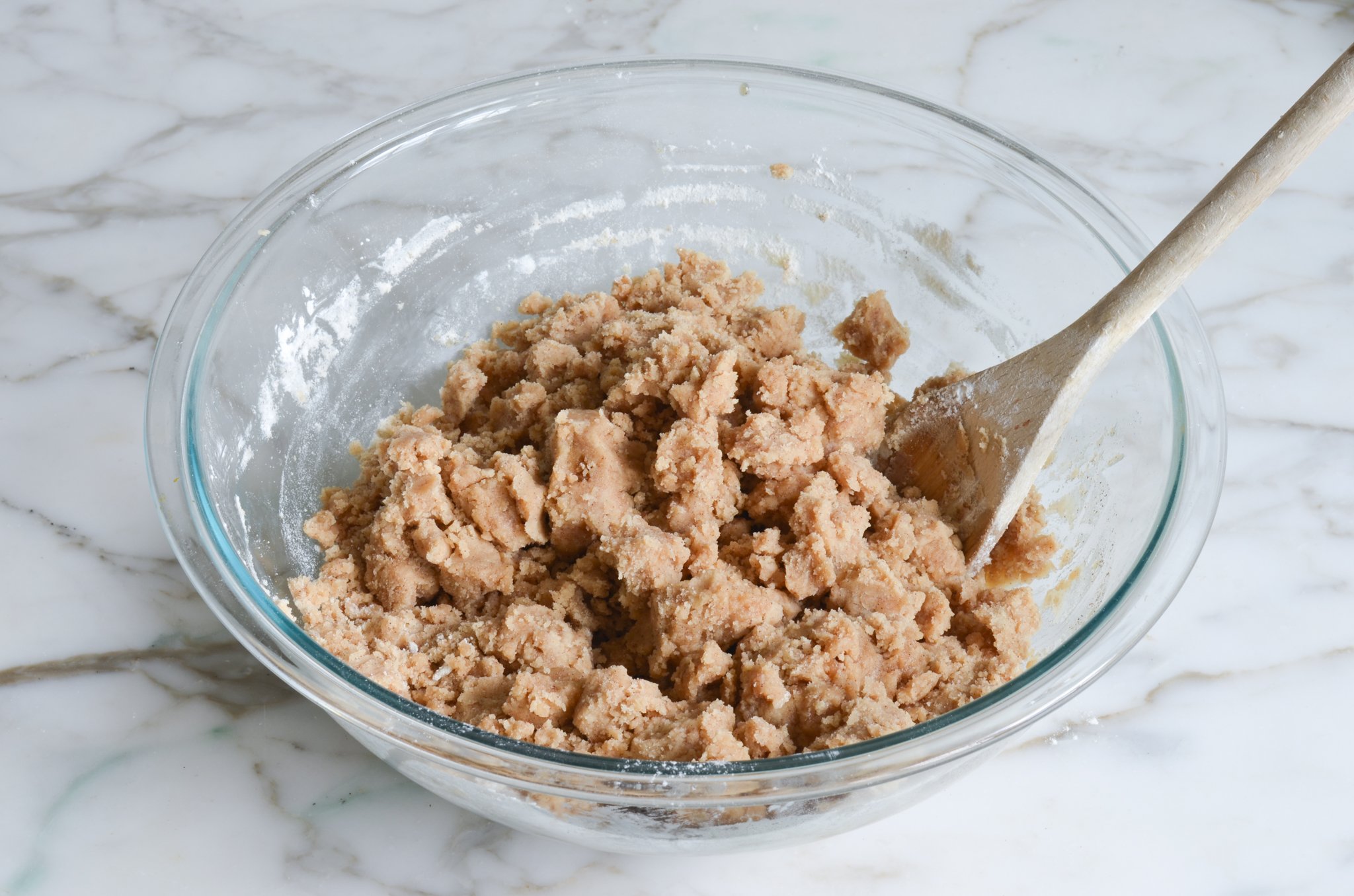 Clumpy crumb topping in a bowl.