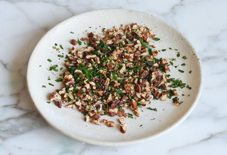 salted pecans and parsley on plate