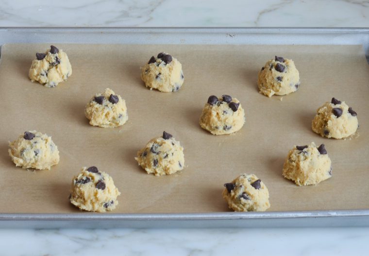chocolate chip cookie dough balls on baking sheet