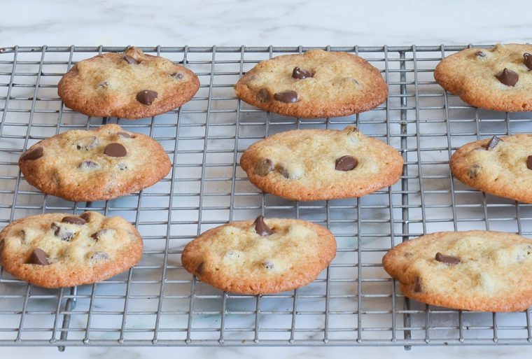 crisp chocolate chip cookies cooling on baking rack