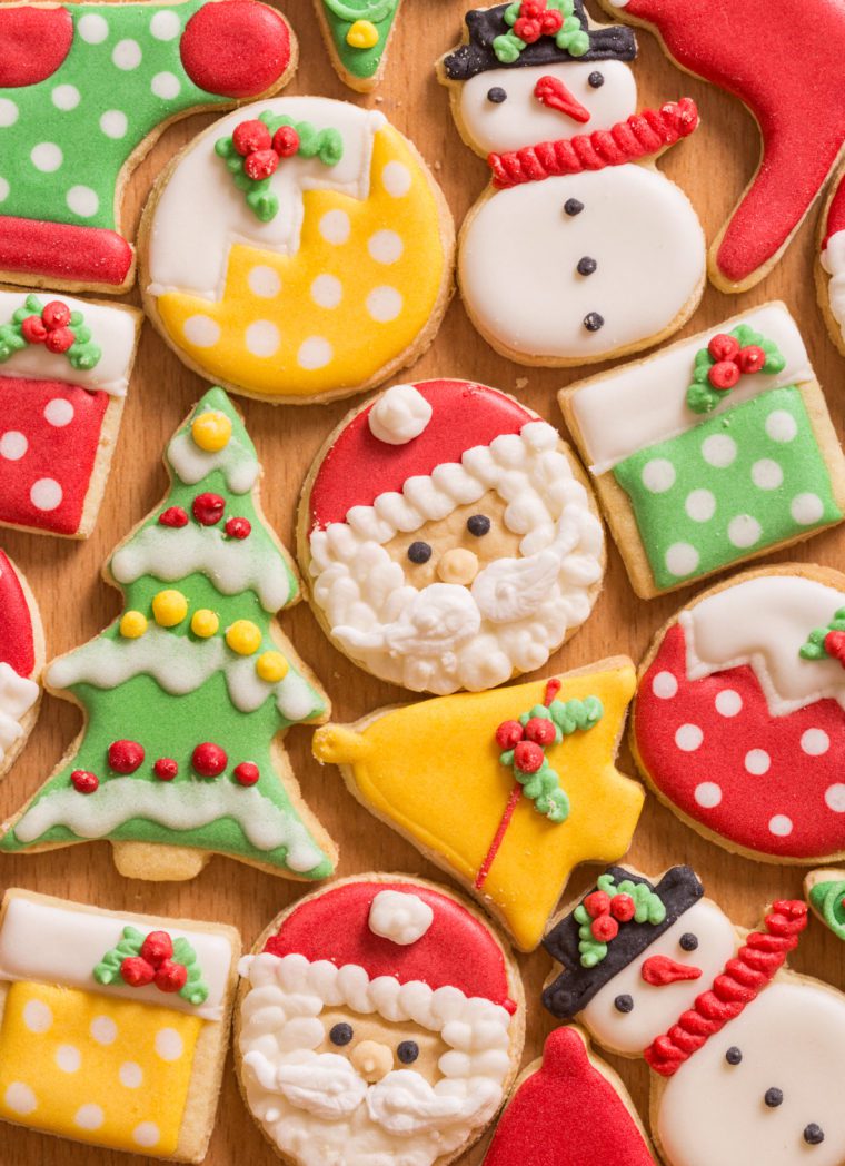 Christmas cookies on wooden board.